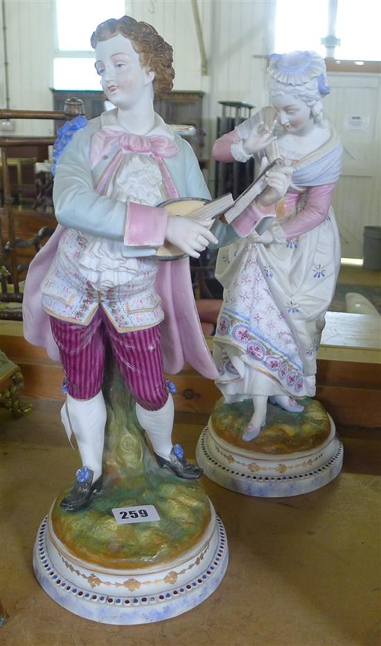 Large pair of painted bisque figures